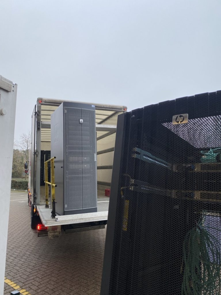 server racks being loaded onto hard sided 18 tonne truck